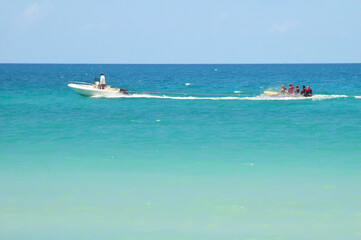 Cuba. August 09, 2019. Varadero: waterboat towing a banana boat