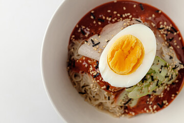 Cold noodles with sauce on white background