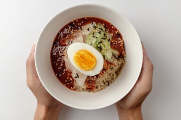 Cold noodles with sauce on white background