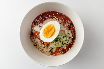 Cold noodles with sauce on white background