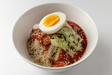 Cold noodles with sauce on white background