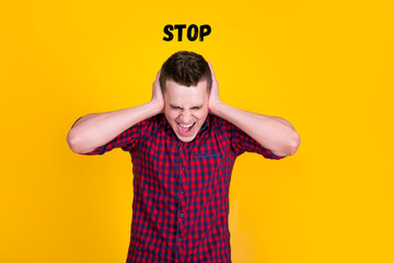 A handsome guy in a red shirt on a yellow background