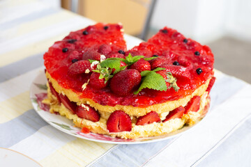 There is a strawberry cake on the table. Selective focus.