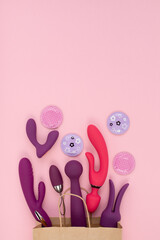 Purple silicone sex toys on a pink background. Erotic toy for fun. Sex gadget and masturbation...