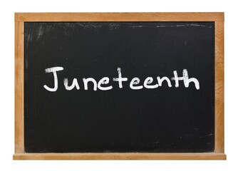 Juneteenth written in white chalk on a black chalkboard isolated on white