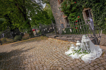 Wedding decorations by the road, along the old building.