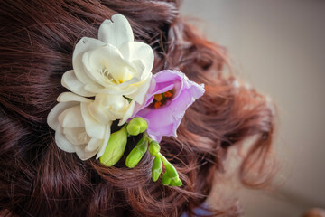 Wedding flower in the hair of the bride.