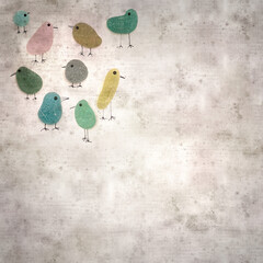 stylish textured old paper background with funny little penguins made of sea glass pebble pieces 