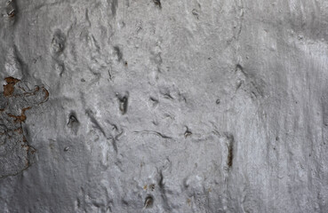 Silver-painted textured surface with grooves, cracks and scratches. Aluminum powder paint.