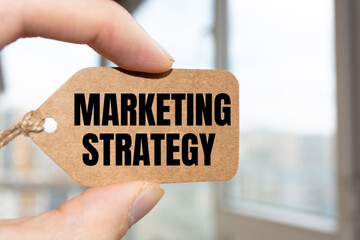 Marketing Strategy text on card. Business concept.