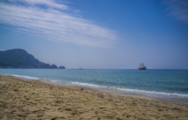 Alanya. Turkey. June 2, 2012; A masted pleasure ship on the horizon of the blue sea.