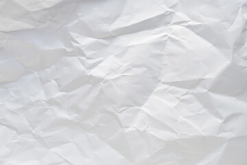 White crumpled paper texture background.