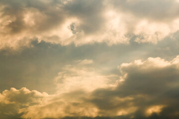 Beautiful evening sky with golden clouds. Sky panorama for screensavers, postcards, calendar, presentations. Low point at wide angle. Warm spring or summer evening.