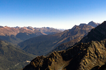 Fototapeta premium daytime landscape in the Caucasian mountains against the blue sky