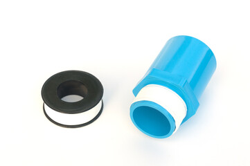 PVC Pipe connections and  pipe thread tape for use in plumbing repairs isolated on a white background.