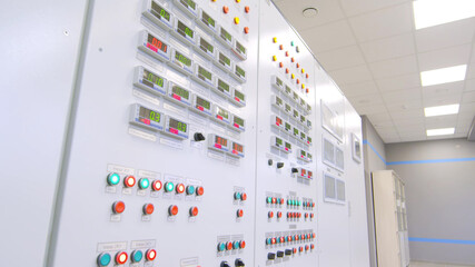 Shot of modern control panel with buttons and switches in factory control room