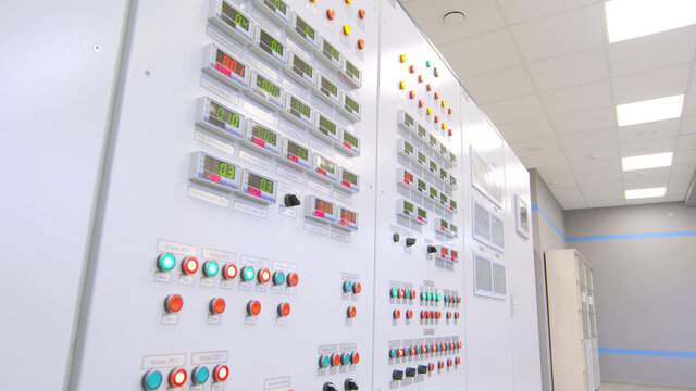 Shot of modern control panel with buttons and switches in factory control room - Powered by Adobe