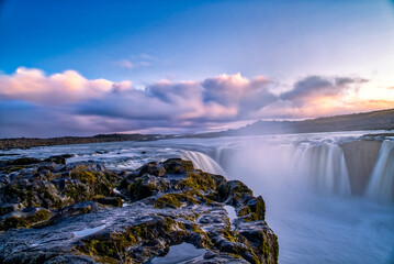The long exposure view of the waterfall of Iceland's Dettifoss at dusk.