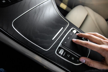 hand holding a car touchpad - obrazy, fototapety, plakaty