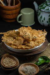 Rempeyek or peyek ikan teri, a deep-fried savoury Indonesian-Javanese cracker made from flour (usually rice flour), lime leaves and other ingredients, bound or coated by crispy flour batter