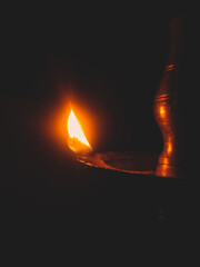 burning lamp on a black background