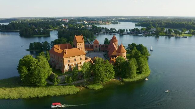 TRAKAI ISLAND CASTLE, TRAKAI, LITHUANIA. Aerial footage of Trakai Castle on an island in Lake Galve. 