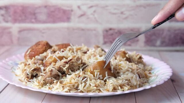  mutton biryani meal in a plate on table.