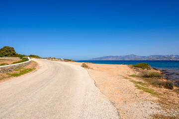 The road on the seafront in the northeast of the island of Paros. Cyclades, Greece