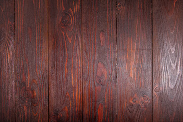 Wooden textured, embossed dark background covered with varnish and stain