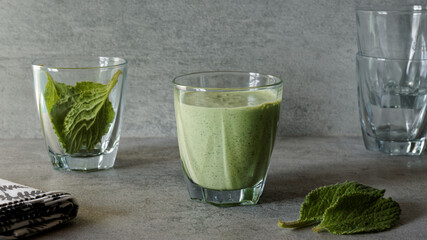 Green smoothie with borage leaves and yoghurt in glass. Healthy detox diet.