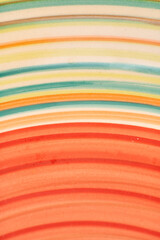 red and yellow stripes on a handmade plate