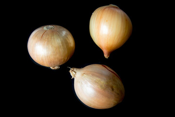 Top view of onion on black isolated