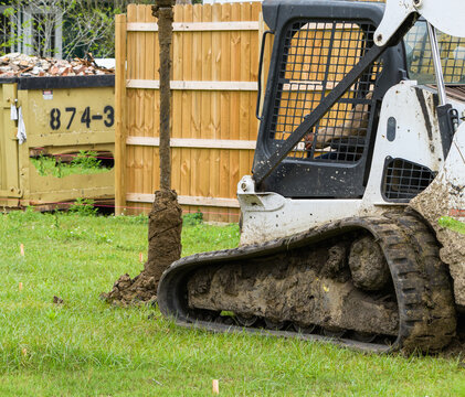 Front-end Loader with Drilling Attachment in Action	