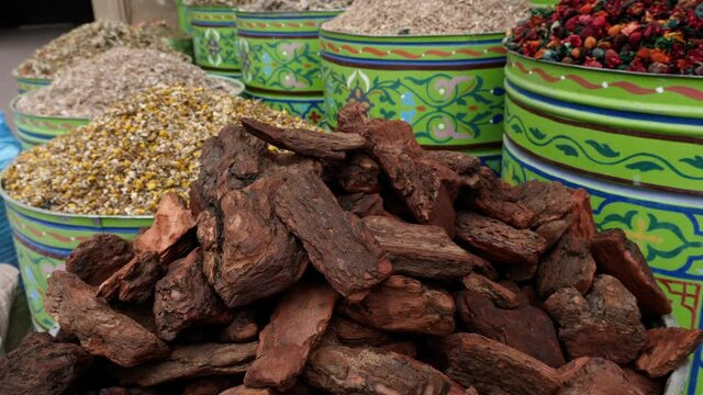 Moroccan incense, sandalwood, herbs, tea. Spice market in the Medina of Marrakech, Morocco.