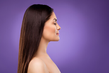 Profile side view portrait of attractive dreamy long-haired girl copy empty blank space isolated over bright violet purple color background