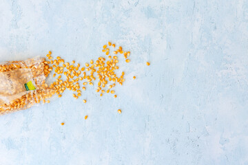 Popcorn kernals on blue background