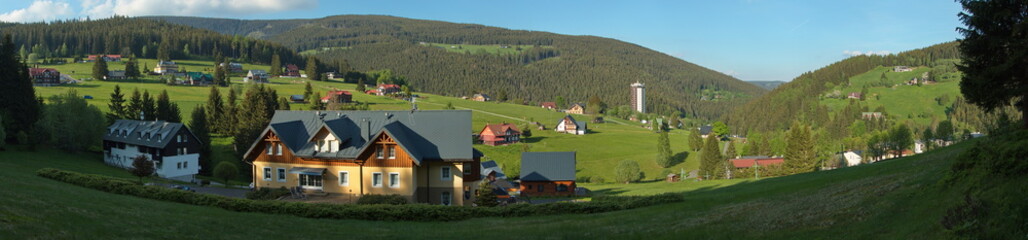 Fototapeta na wymiar Residential buildings in Pec pod Sněžkou in Giant Mountains, Czech Republic, Europe 