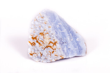 Macro mineral blue agate in the rock on white background