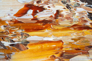 Embossed pasty oil paints and reliefs. Primary colors: ocher, white, yellow.  Abstract art.