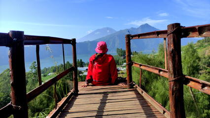 someone who is enjoying nature, mountain view