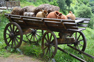 Old wooden cart with clay jugs © Arevik