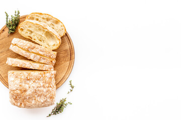 Freashly backed bread slice on cutting board, top view
