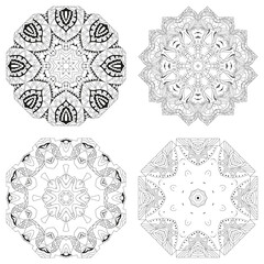 Hand drawn zentangle set of 4 mandalas for coloring page.
