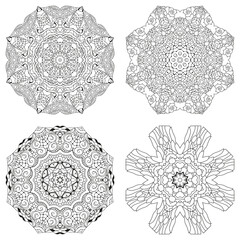 Hand drawn zentangle set of 4 mandalas for coloring page.