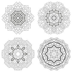 Hand drawn zentangle set of 4 mandalas for coloring page.