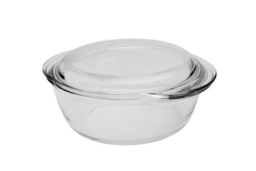 Transparent pan for cooking and baking made of heat-resistant glass, closed with a lid. Close-up on a white background