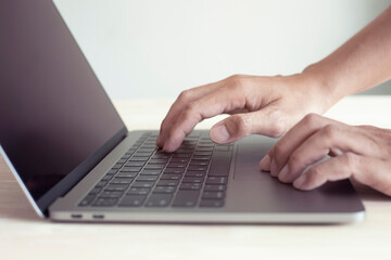 Hands of business people working remotely at home, Man typing on laptop or computer