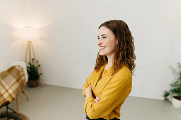 Happy charismatic young woman grinning in amusement