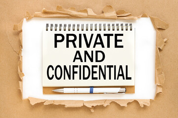 PRIVATE and CONFIDENTIAL. text on notepad near torn paper