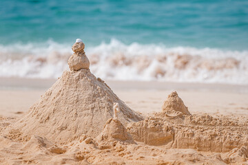 sand castles on the beach as a symbol of a holiday with children at the sea
